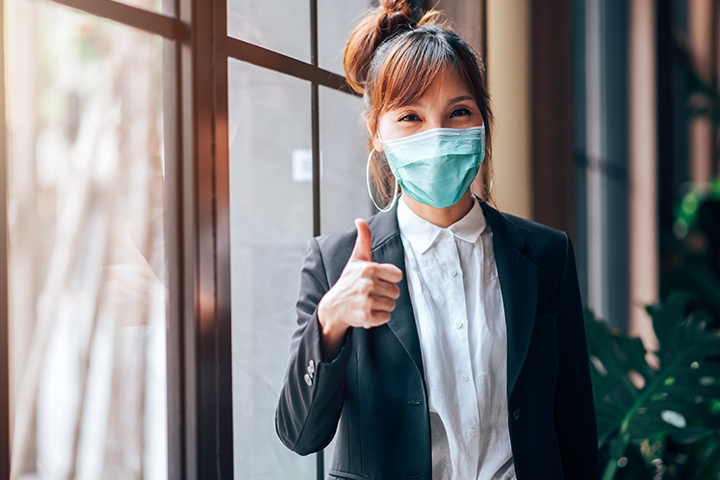 health-insurer-wrangles-tangle-of-outbound-communications-quadient-inspire-flex Business Woman Standing and Showing Thumbs up in Working Office. Healthcare and Business Concept