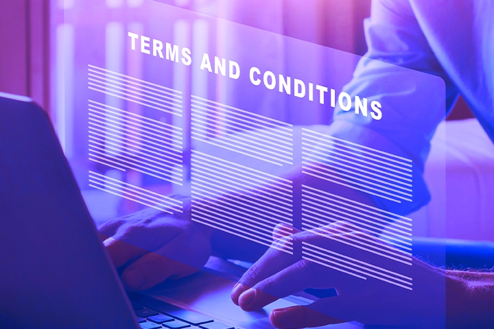 Planning for Recessionary Software Audits man searching for terms and conditions on laptop